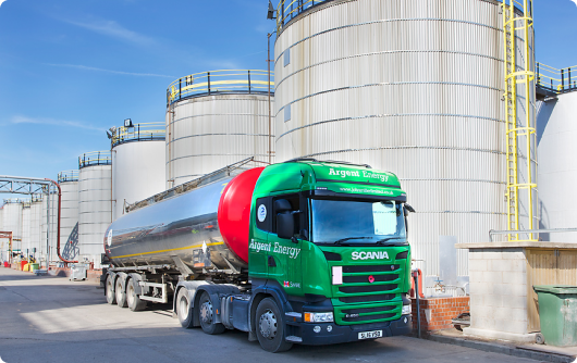 green lorry parked in biofuel plant compressed