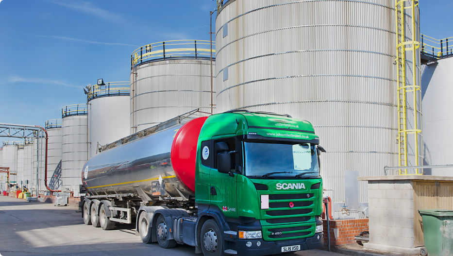 green lorry parked in biofuel plant